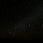 Capture of the starry night sky over Ksar Tanamouste, Morocco, showcasing a vibrant universe.
