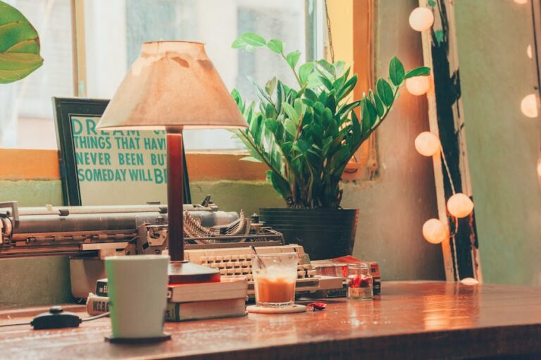 A nostalgic vintage workspace featuring a typewriter, coffee, books, and plants, creating a warm and inviting ambiance.
