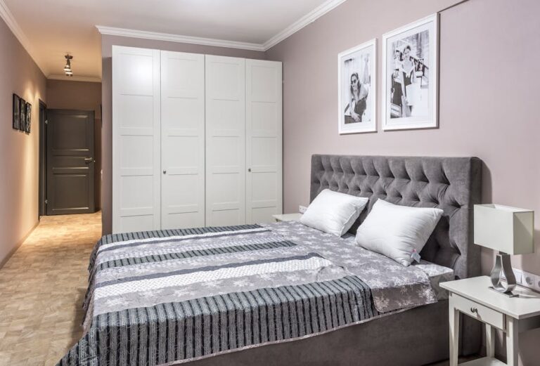 Elegant and cozy bedroom with modern furniture and decor elements.